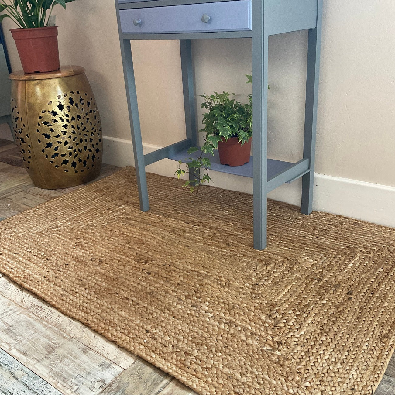 Braided Natural Jute Rug with a Frenchic Upcycled Blue Console Table and a Plant stand