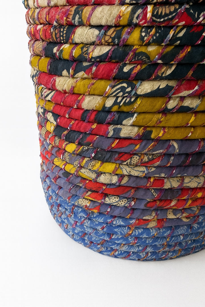 Stack of 2 colourful braided baskets on a white background
