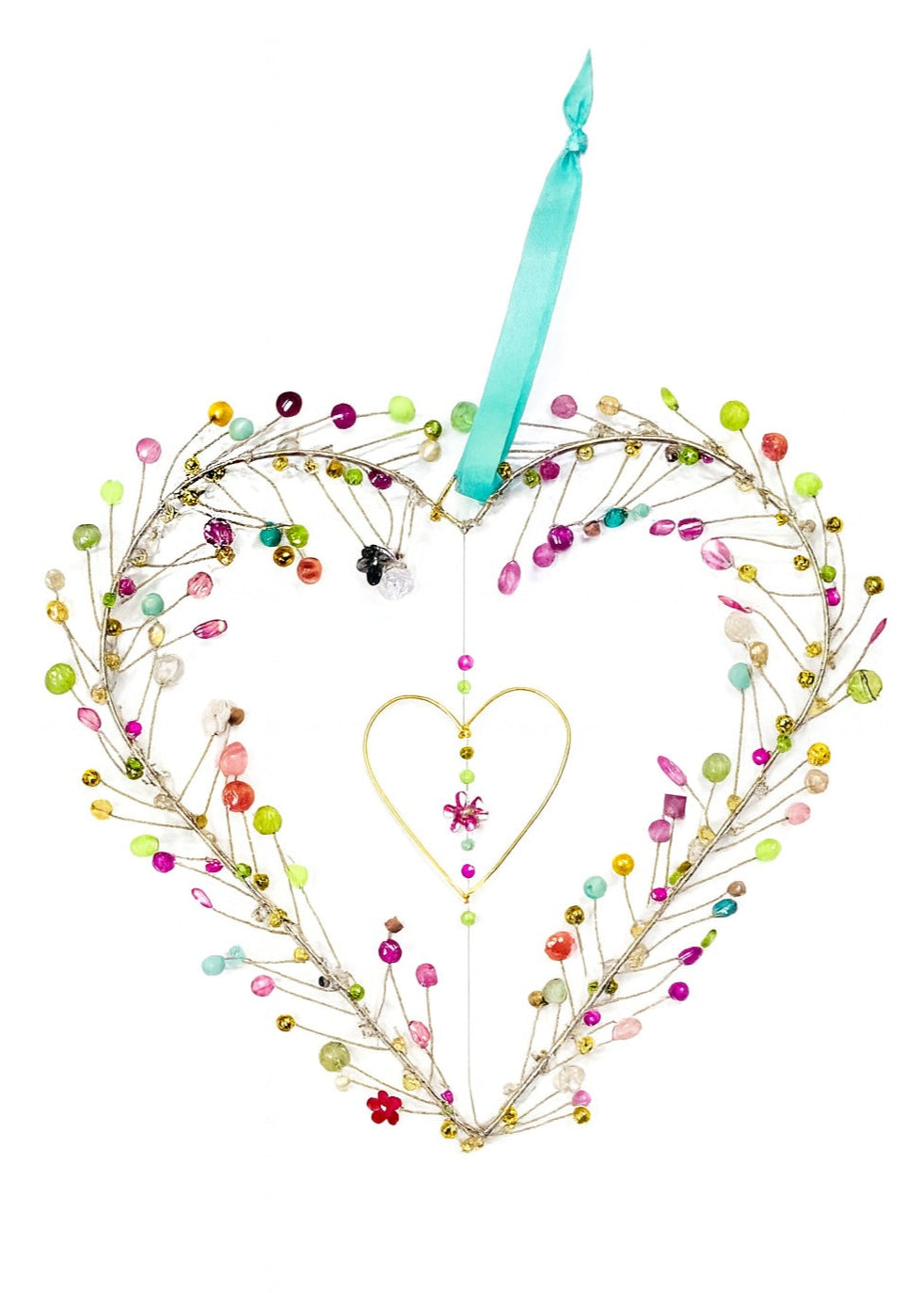 Decorative heart-shaped decoration with colourful beads and a blue ribbon on a white background