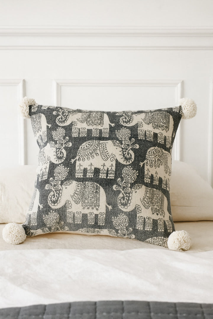 Decorative pillow with elephant pattern on a white couch