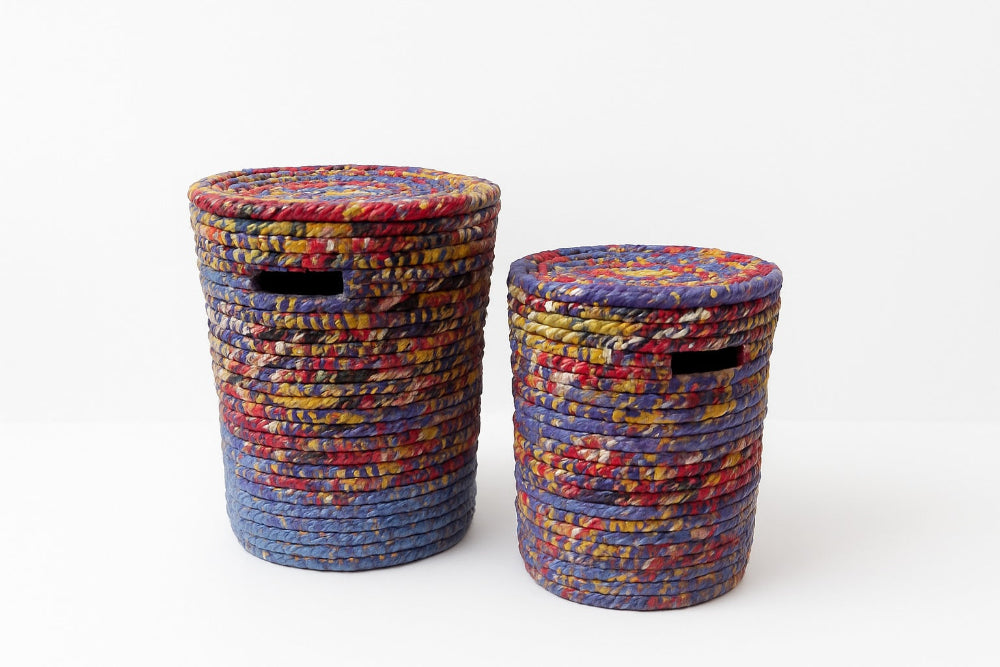 Two colourful woven baskets on a white background