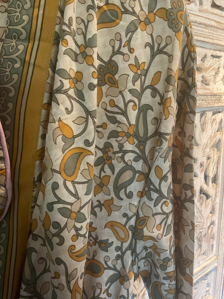 Close up of Mustard Yellow and Green Sari Robe