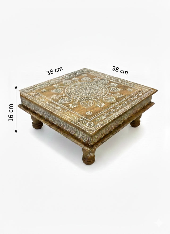 Decorative wooden table with intricate carvings and measurements on a white background