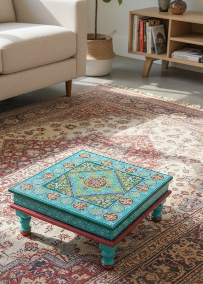 Decorative coffee table with colourful turquoise pattern in a living room setting