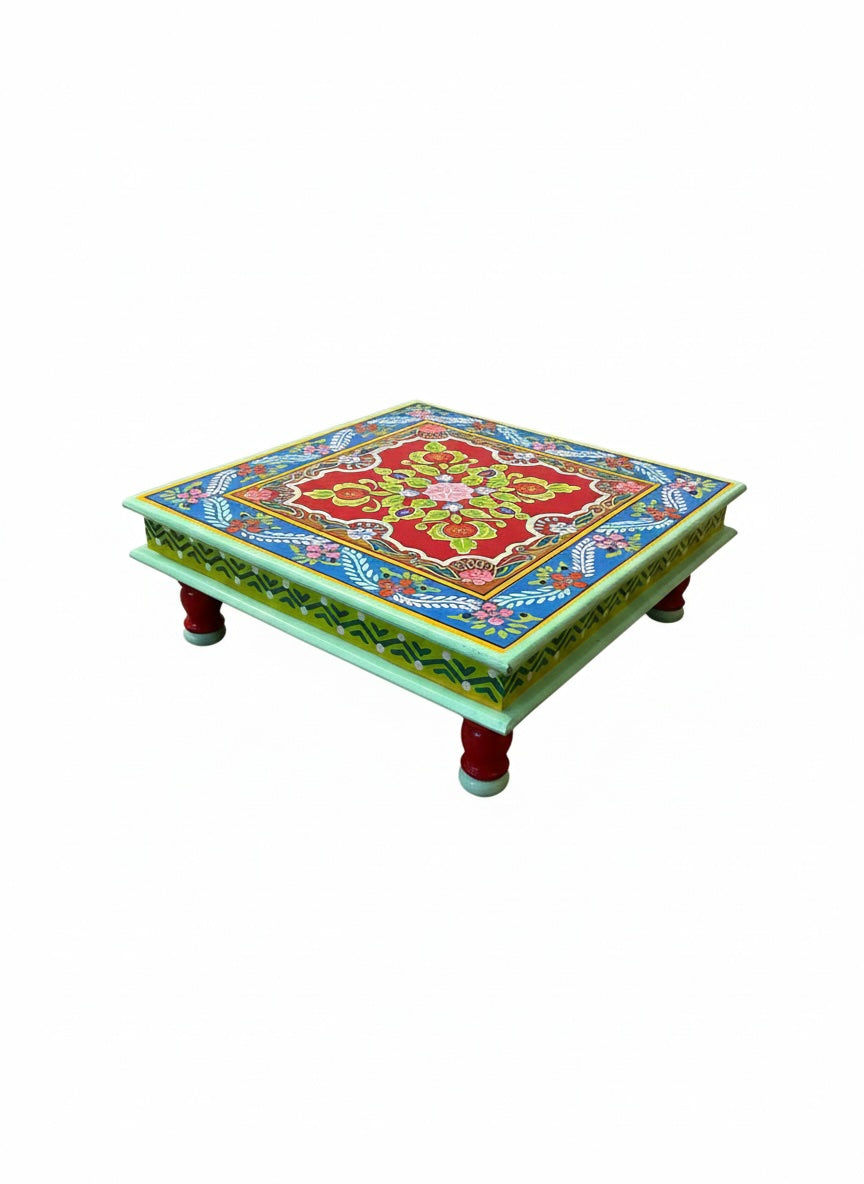 Decorative table with colorful floral design on a white background