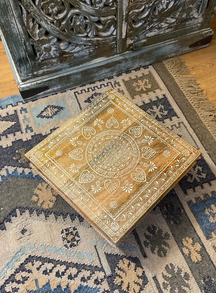 Birds Eye View of Wooden Bajot Table on a blue kilim rug