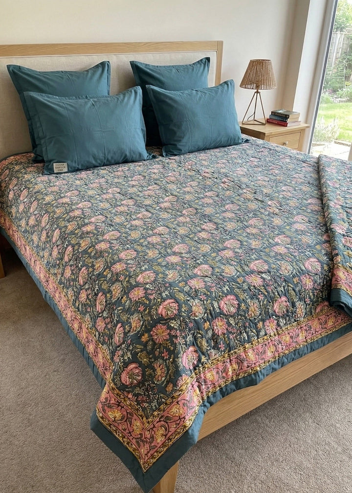Block Print Floral Duvet Cover on a Bed with cushions and lamp