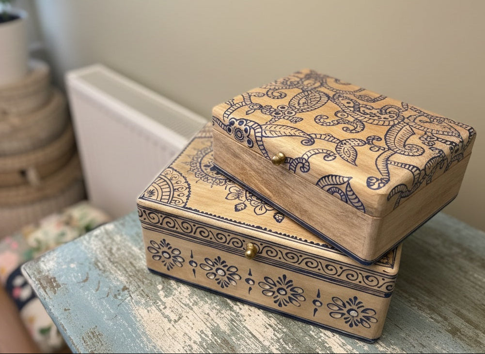 Wooden jewellery box with intricate patterns on a surface