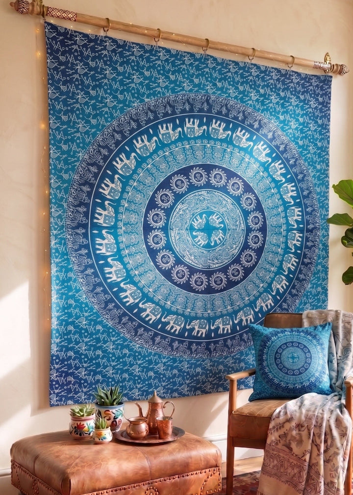 Blue Cotton Elephant Print Wall Hanging with a chair pouf and Cushion.