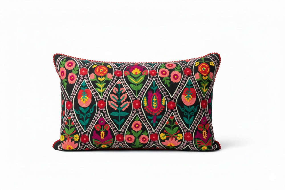 Decorative pillow with blue colourful floral patterns on a white background