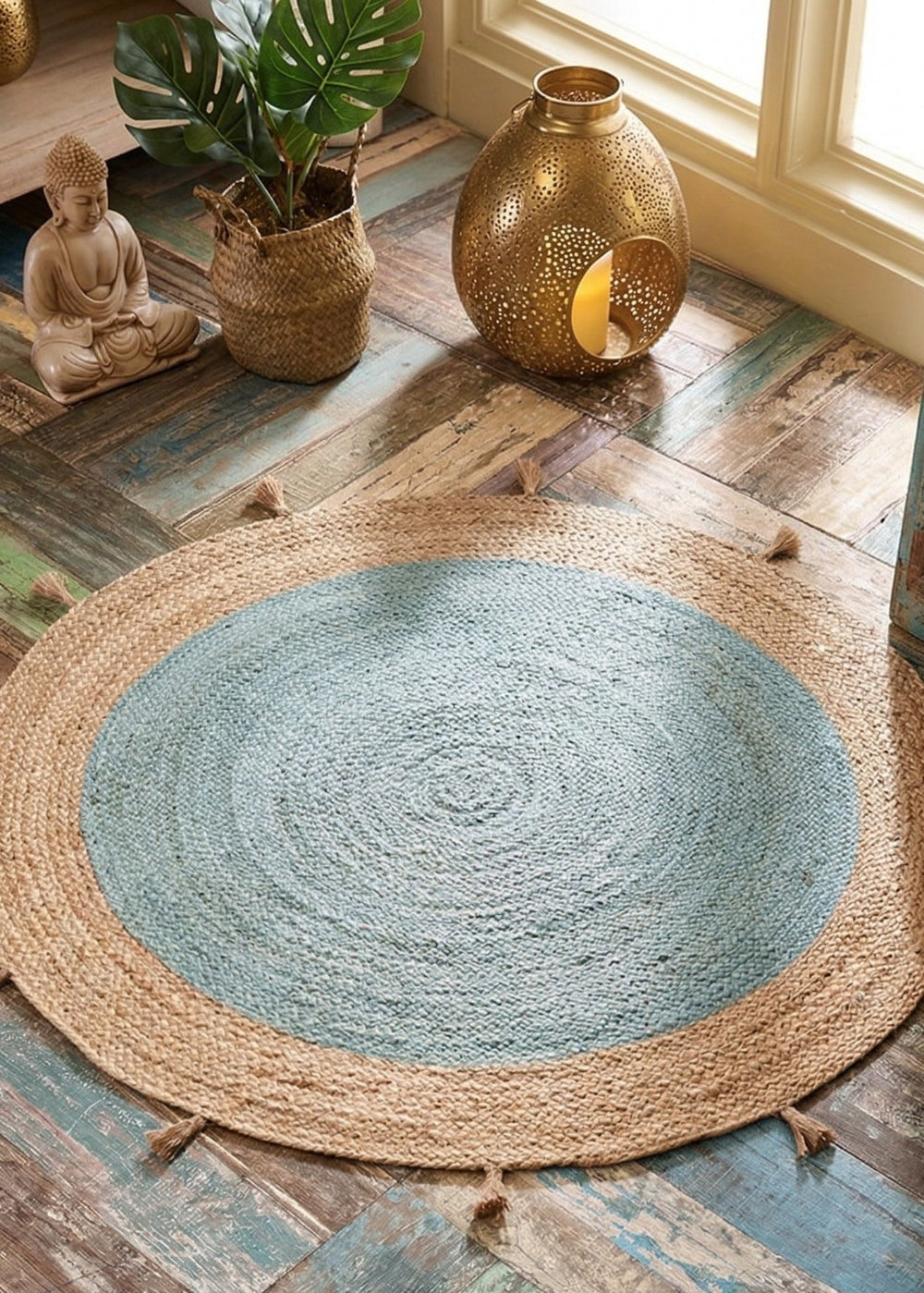 Round woven rug on a wooden floor with decorative items.