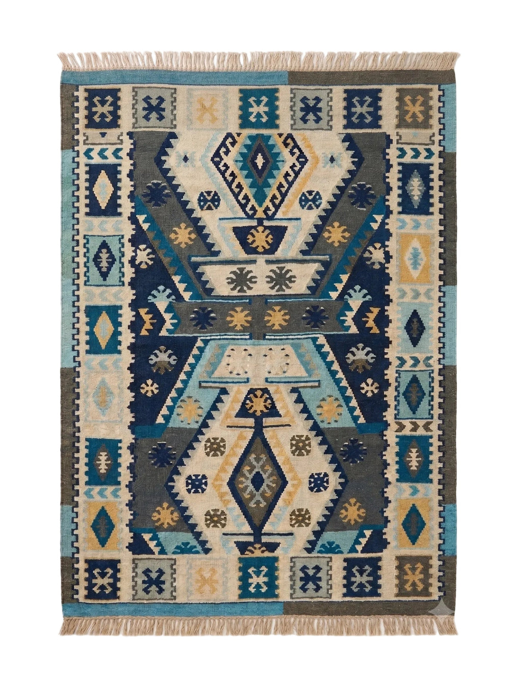 A rectangular woven rug with a Southwestern geometric pattern in navy blue, teal, beige, and brown, featuring fringed edges on a white background.