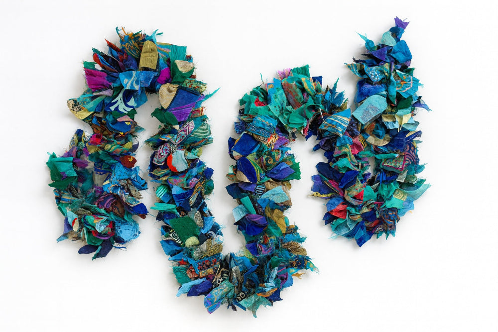 Colorful fabric wreath with a white background