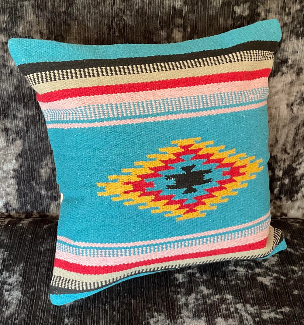 Decorative pillow with a geometric pattern on a textured surface