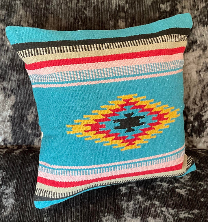 Decorative pillow with a geometric pattern on a textured surface