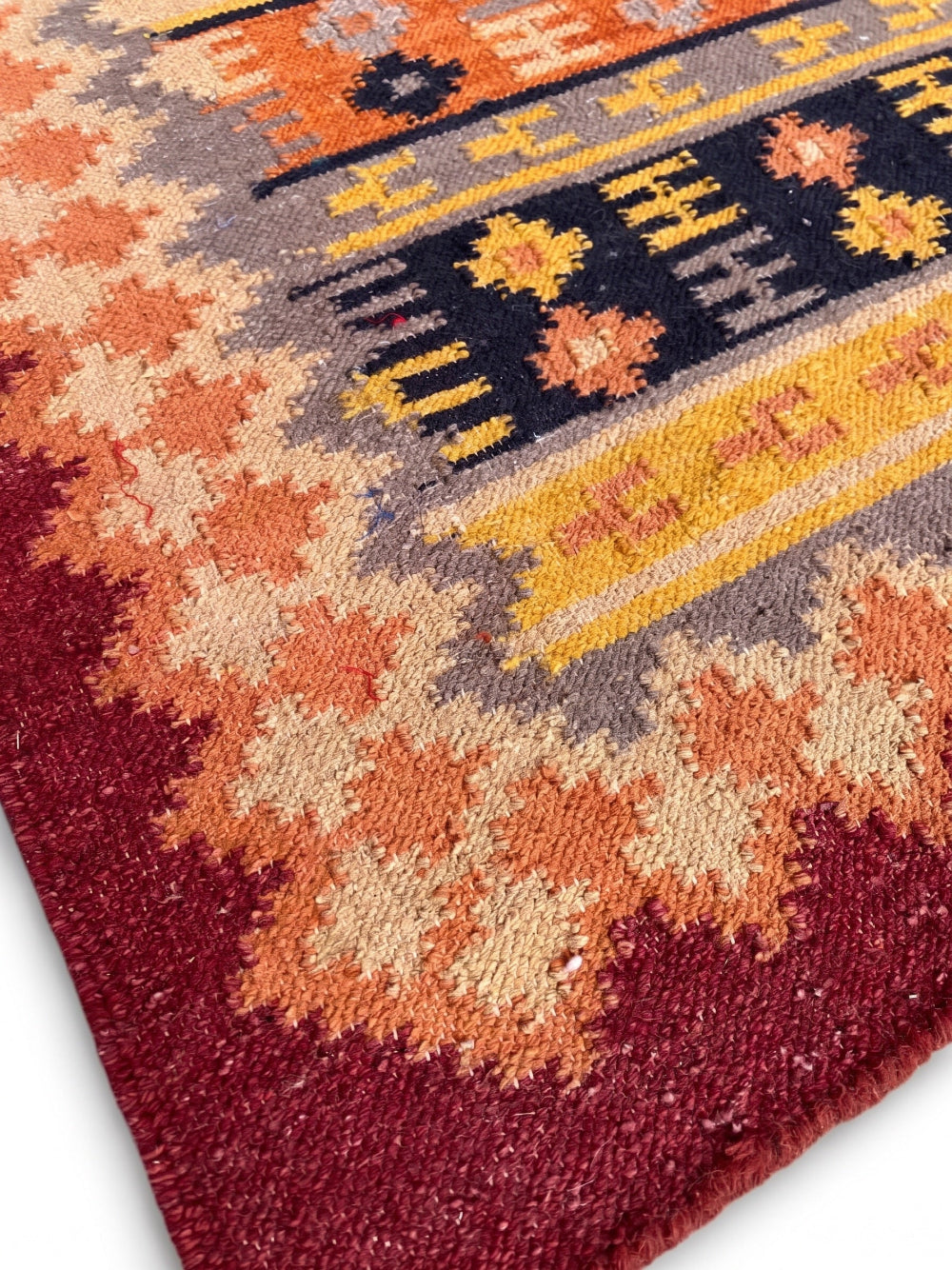 Close-up of a patterned rug with geometric design