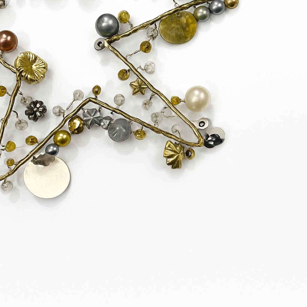 Star Decoration with various beads and charms on a white background