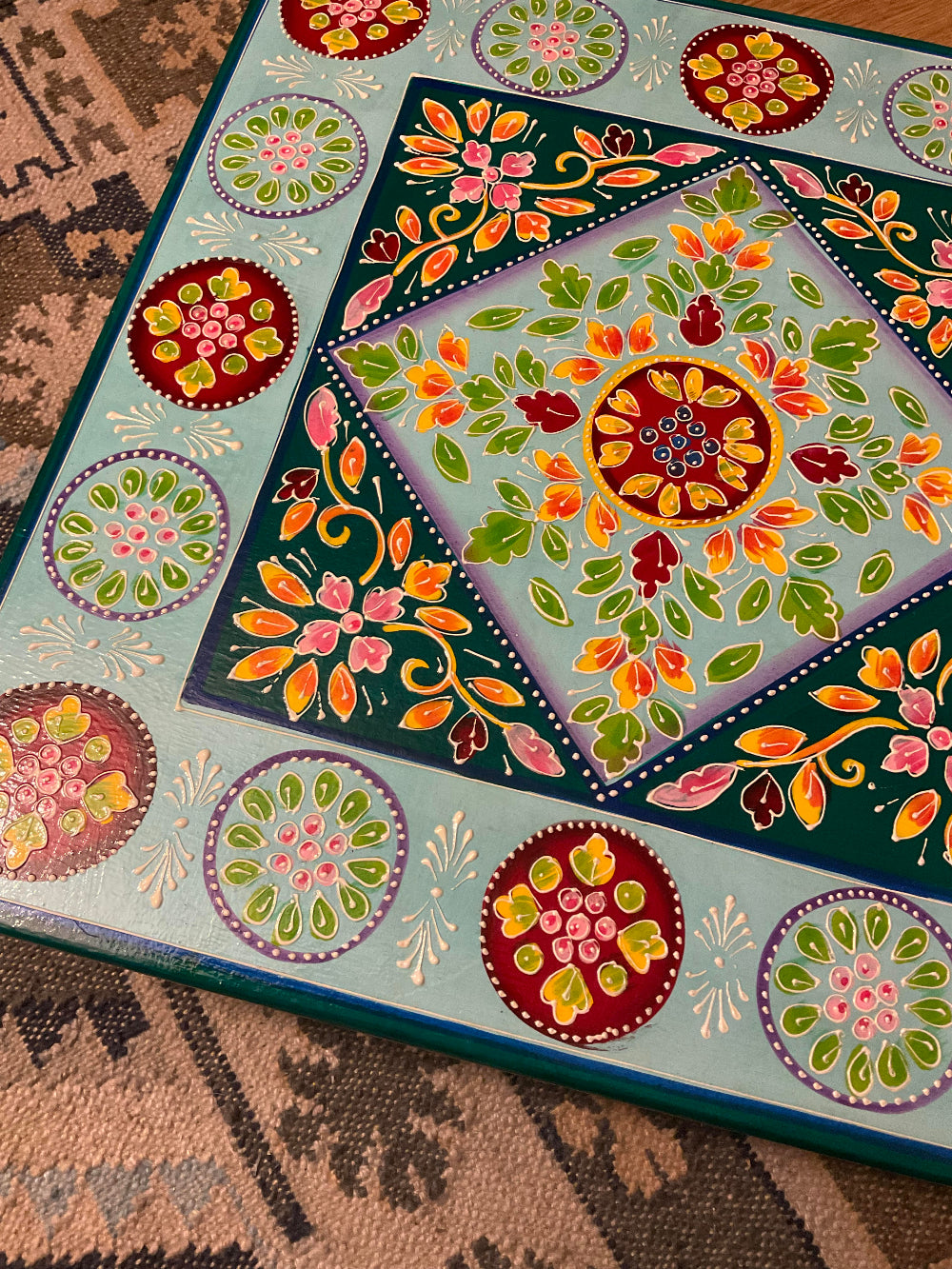Colourful floral and geometric patterns on a textured surface