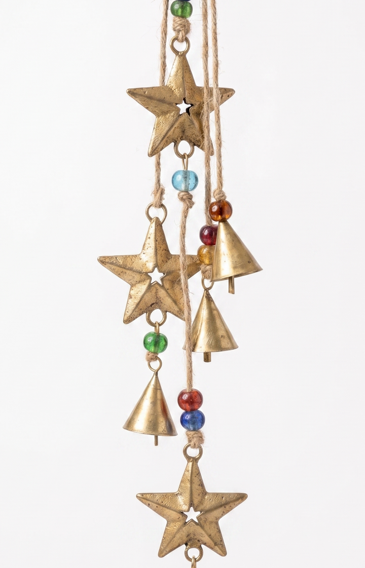 Decorative hanging ornament with stars and bells on a white background