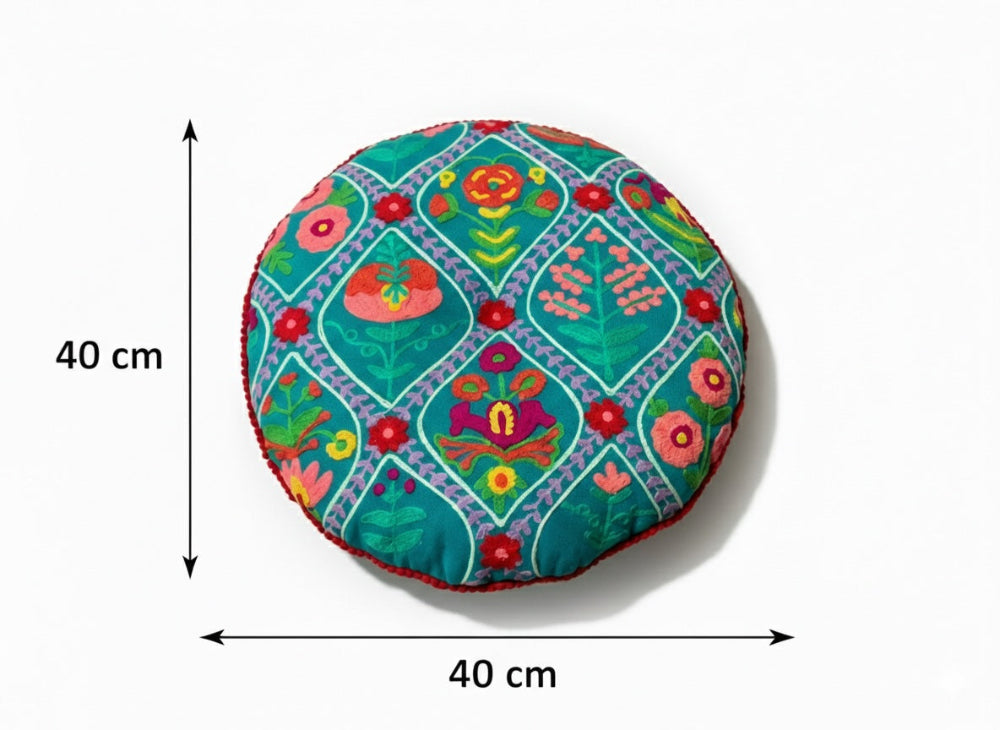 Decorative round cushion with floral pattern and measurements on a white background