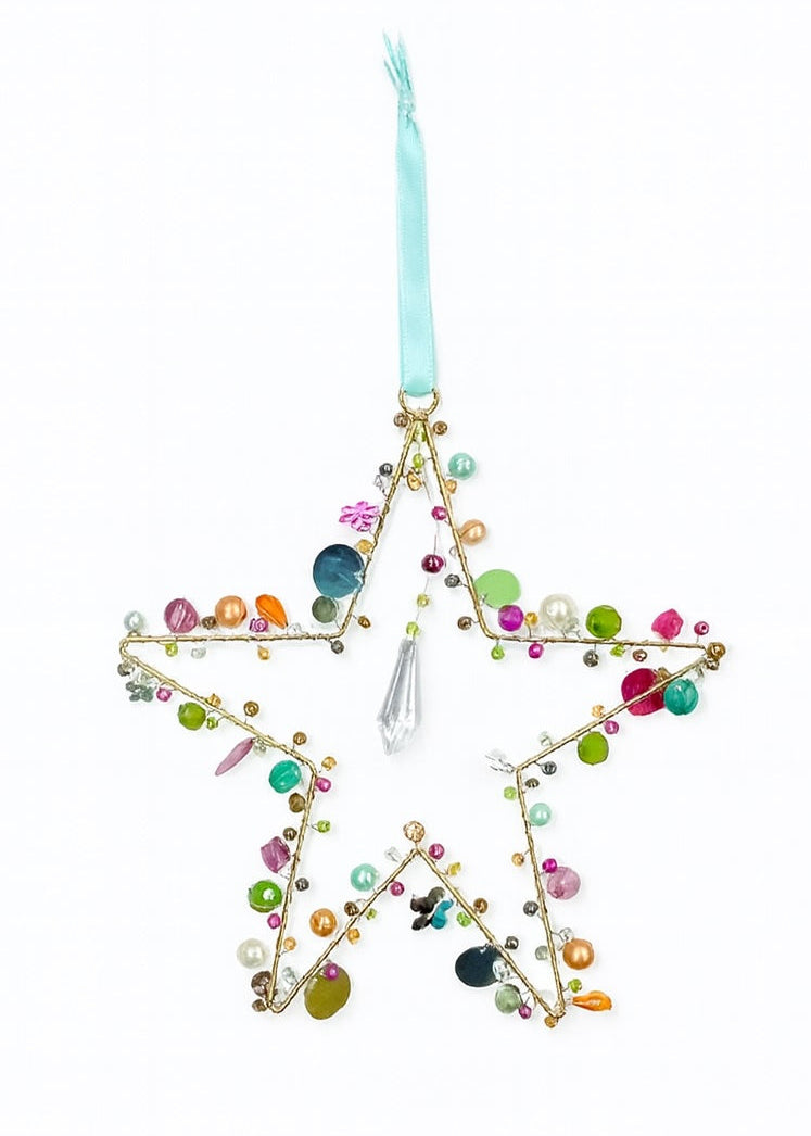 Gold Star Decoration With Beads and Sequins in a White Background