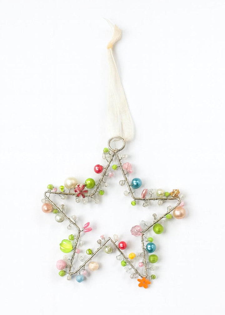 Decorative star ornament with colorful beads on a white background