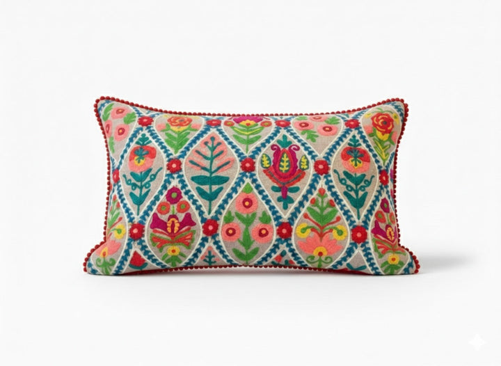 Decorative pillow with colourful natural floral pattern on a white background