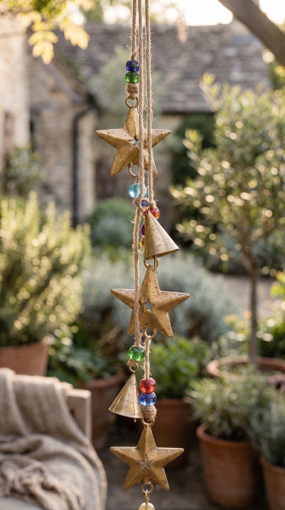 Decorative hanging with stars and beads in a garden setting