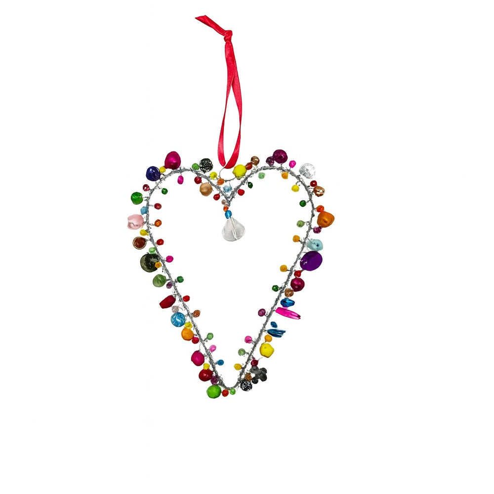 Heart-shaped decorative ornament with colourful beads and a pink ribbon on a white background