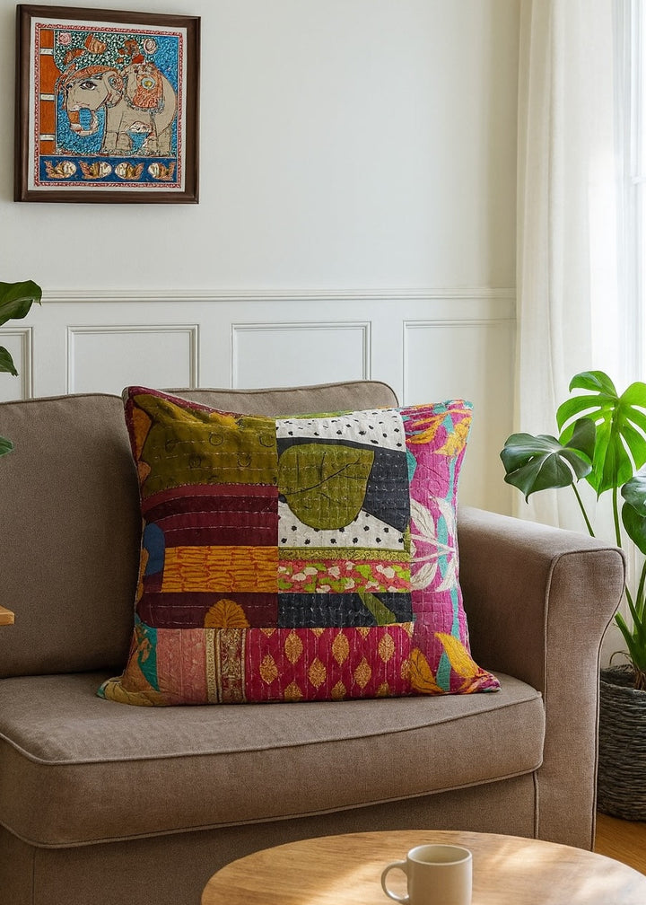 Kantha Cotton Patchwork Cushion Cover 60 cm x 60 cm sitting on a chair.
