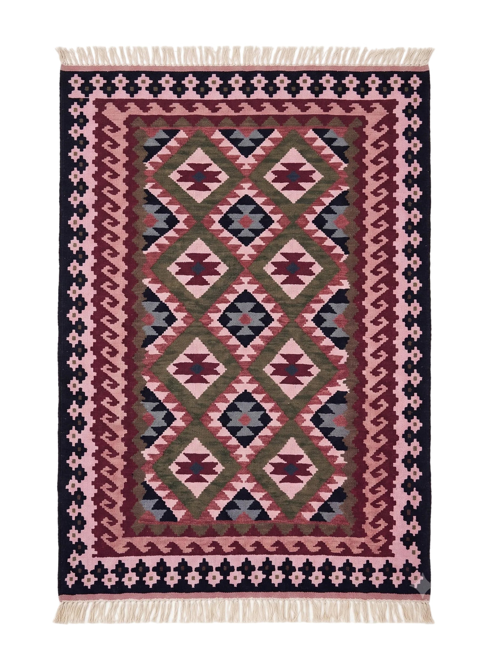 A rectangular woven area rug with a Southwestern geometric pattern in pink, burgundy, olive green, and navy blue, finished with cream-coloured fringe on the top and bottom edges.