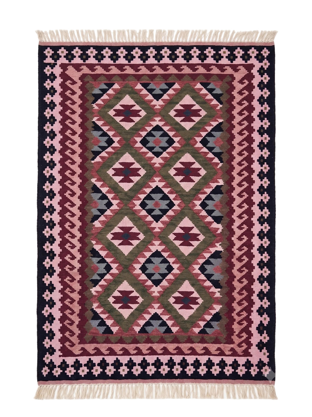 A rectangular woven area rug with a Southwestern geometric pattern in pink, burgundy, olive green, and navy blue, finished with cream-coloured fringe on the top and bottom edges.