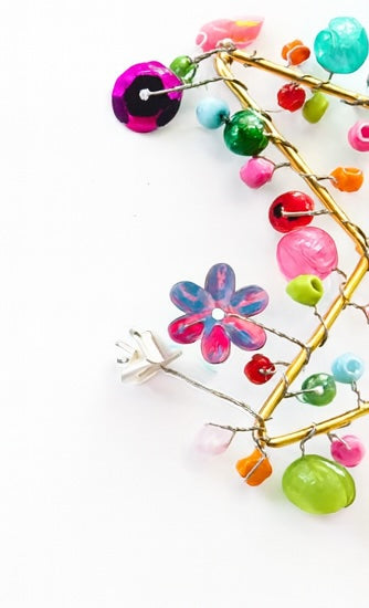Colourful Decoration with flowers and beads on a white background