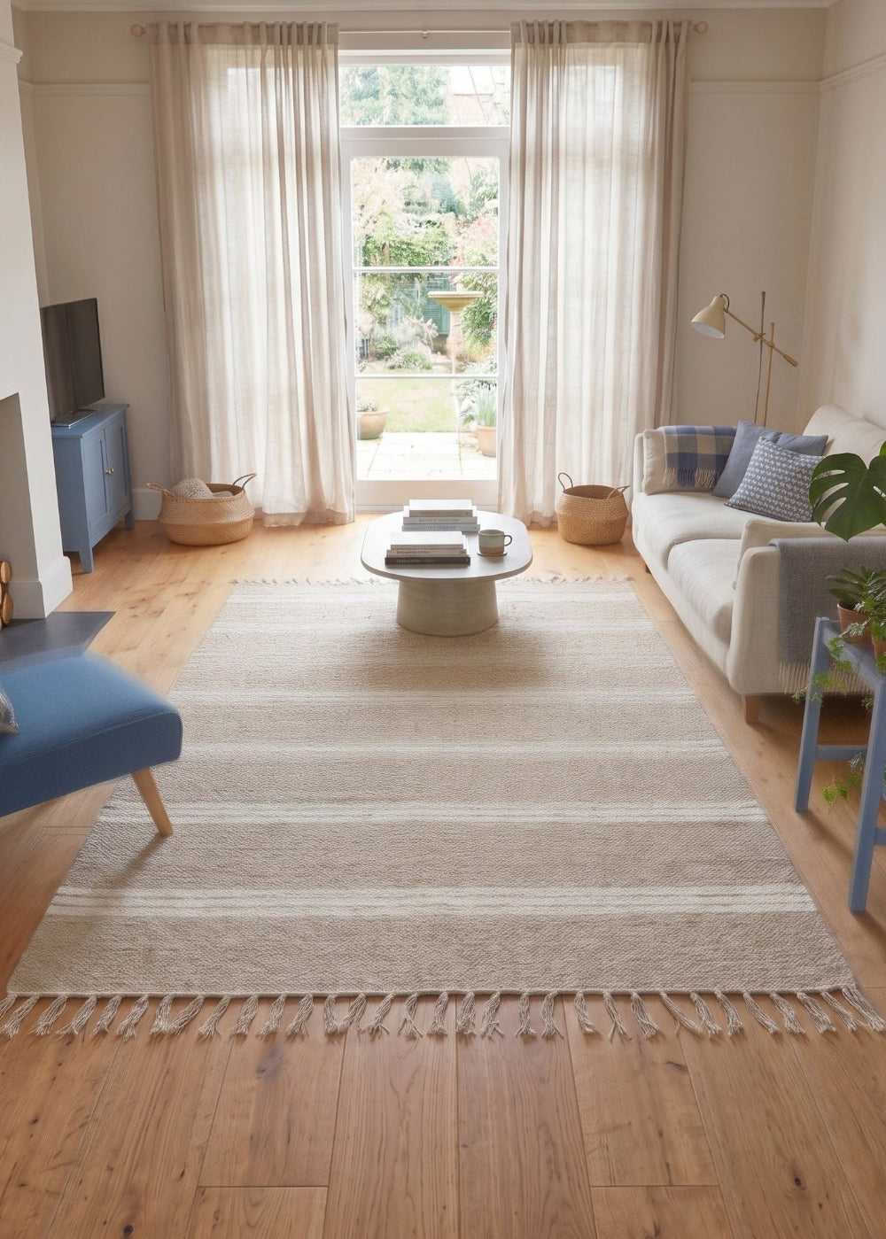 A natural Rug with a triple striped design in a living room and sofa