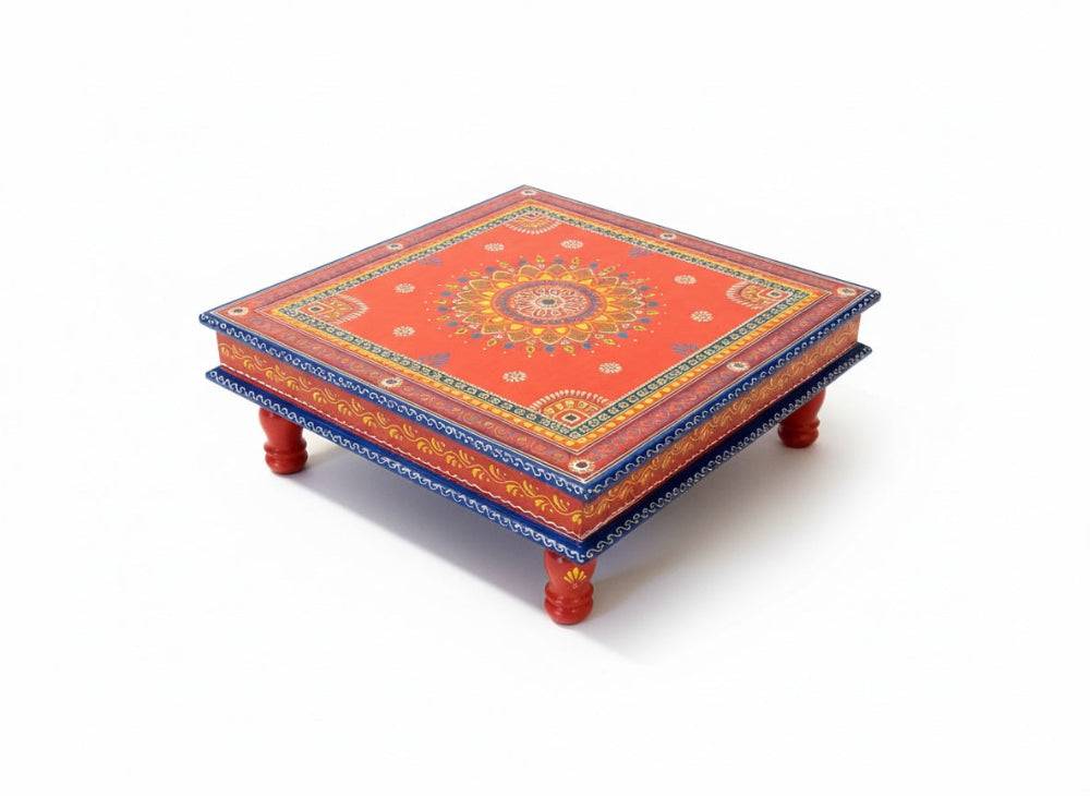 Decorative wooden table with intricate patterns on a white background