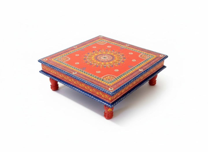 Decorative wooden table with intricate patterns on a white background