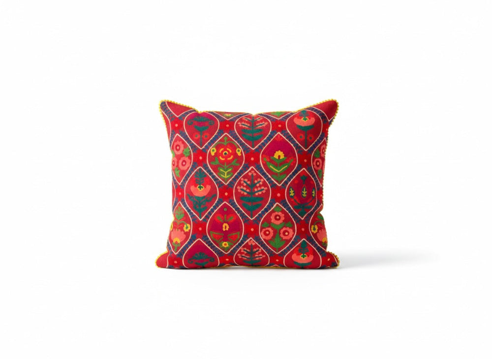 Decorative pink cushion with indian pattern on a white background