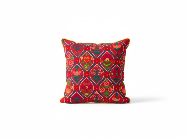 Decorative pink cushion with indian pattern on a white background