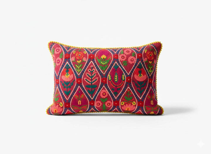 Decorative pillow with colourful pink geometric pattern on a white background