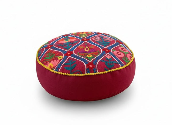 Decorative cushion with colourful Indian pattern on a white background