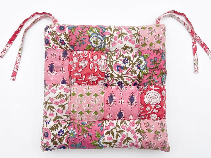 Pink Floral patchwork drawstring seat pad on a white background