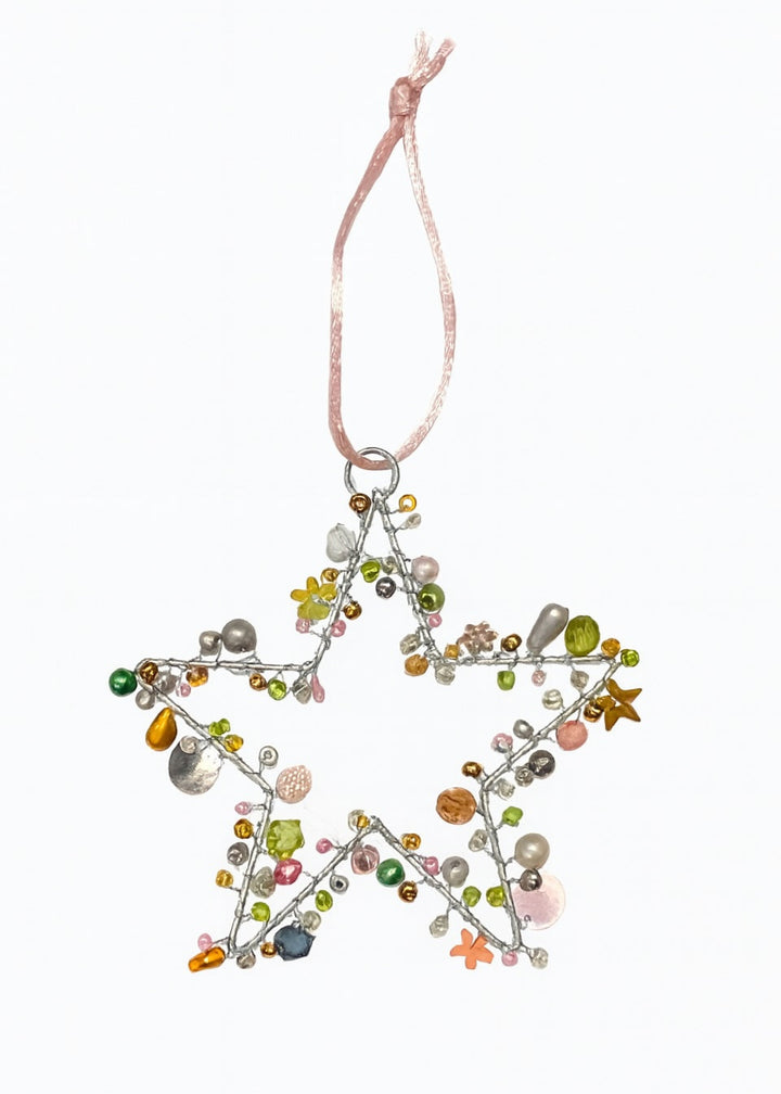 Star-shaped decorative ornament with green and multi coloured beads on a white background