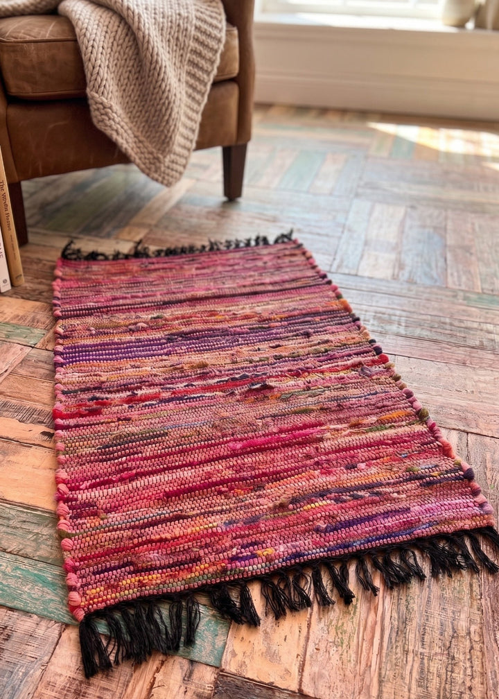 Pink Cotton Fleece Rug on a wooden floor