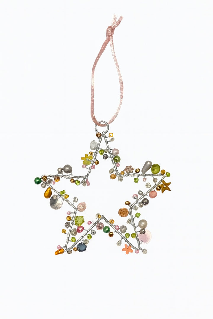 Star-shaped decorative ornament with multicolored beads on a white background