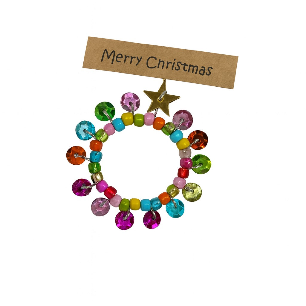 Colourful beaded wreath ornament with a gold star on a white background