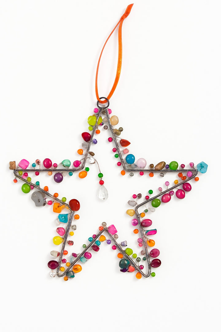 Star-shaped ornament with colourful beads on a white background
