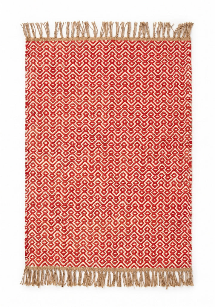 A rectangular woven area rug with a red and beige geometric pattern and fringed edges, shown flat against a white background.