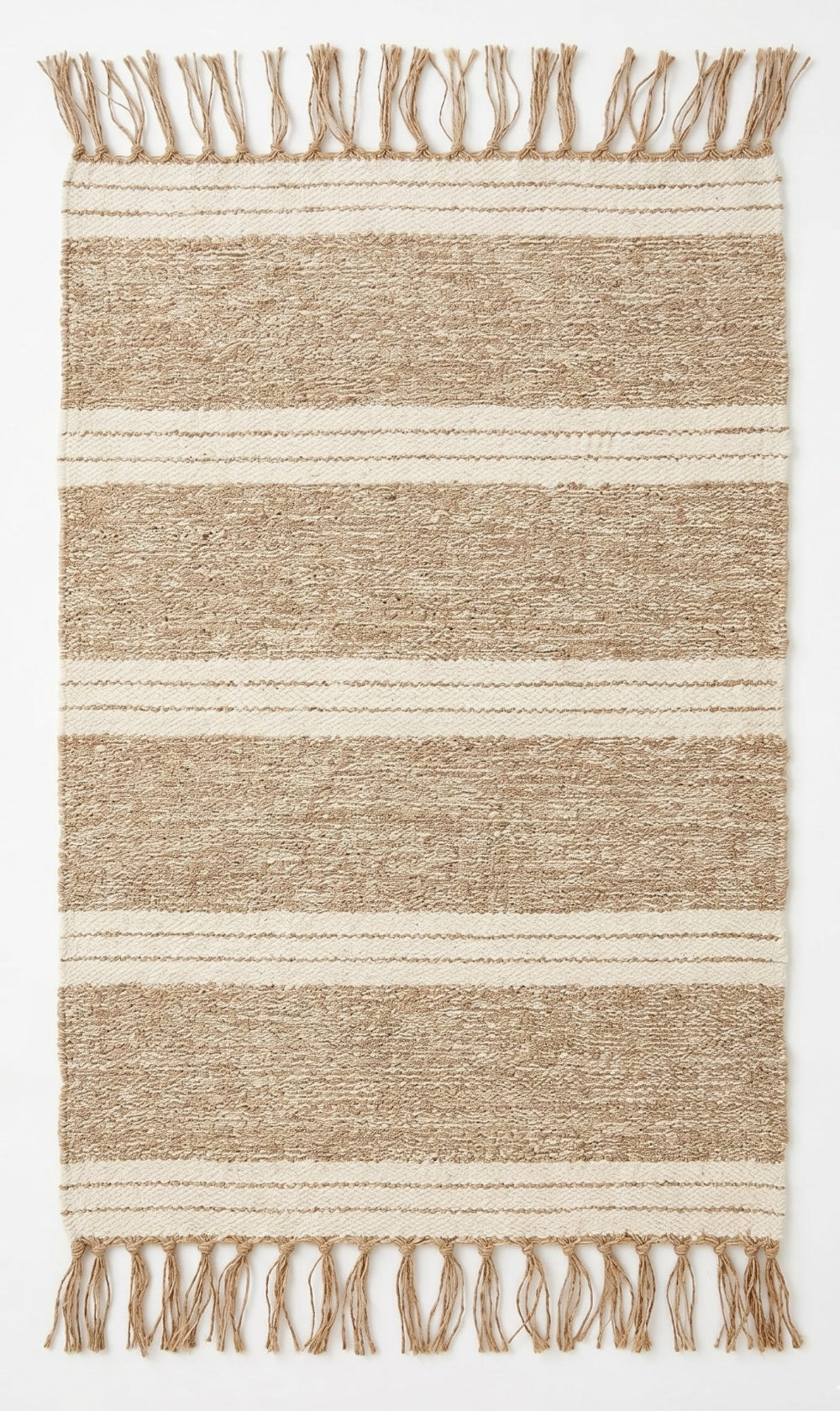 Striped jute rug with fringes on a plain background