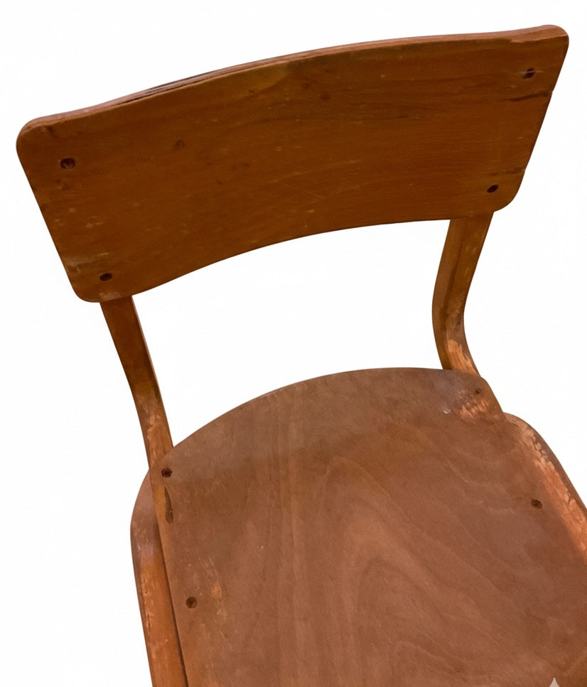 A Close Up of a retro old school chair in a white backround.