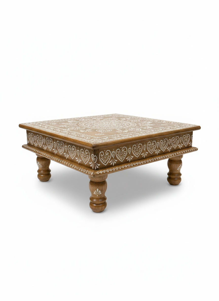 Decorative wooden coffee table with intricate hand painted design on a white background
